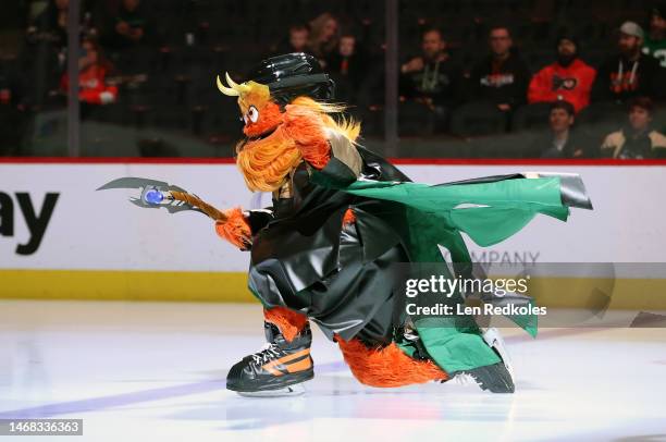 Gritty the mascot of the Philadelphia Flyers skates onto the ice prior to an NHL game against the Nashville Predators at the Wells Fargo Center on...