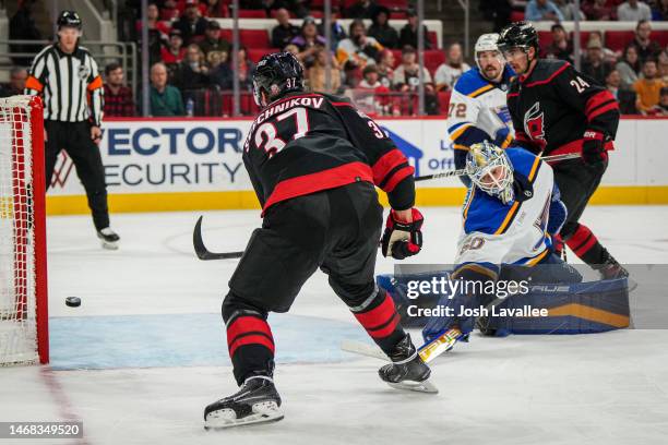 Andrei Svechnikov of the Carolina Hurricanes scores a goal against Jordan Binnington of the St. Louis Blues during the first period at PNC Arena on...