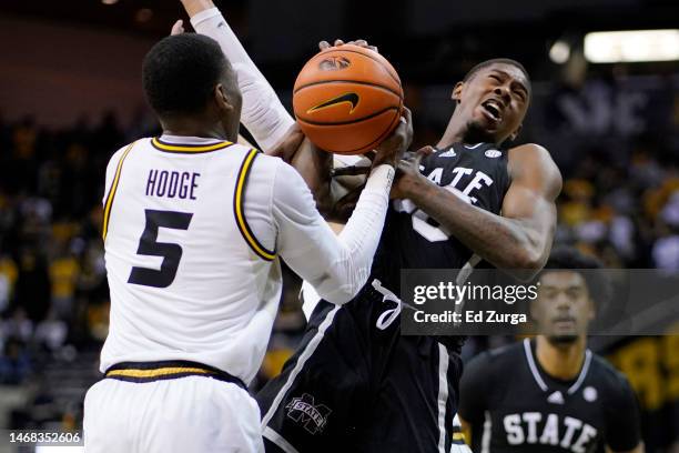 Moi Hodge of the Missouri Tigers and Shawn Jones Jr. #30 of the Mississippi State Bulldogs battle for a rebound in the first half at Mizzou Arena on...