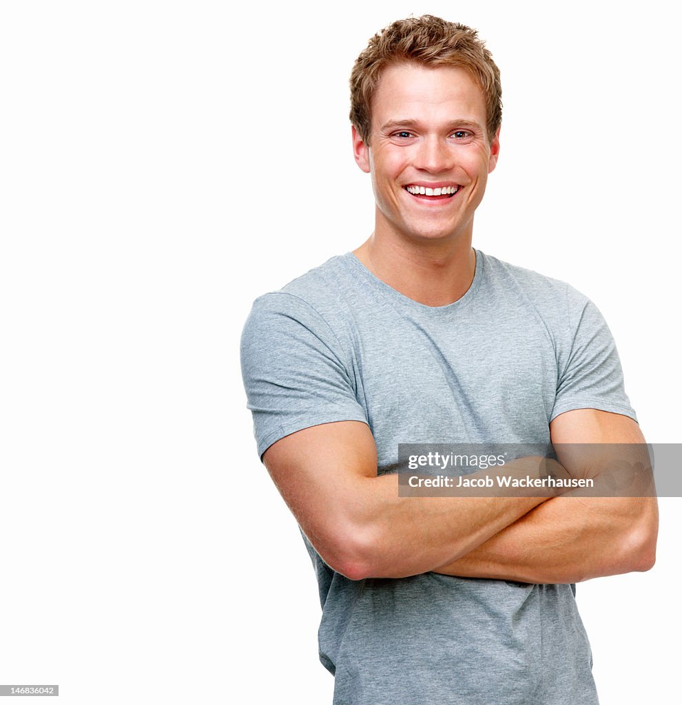 Close-up of a handsome young man smiling against white background
