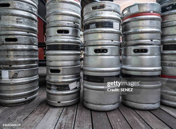 stack of shiny stainless steel beer kegs outside of pub - brewer street stock pictures, royalty-free photos & images