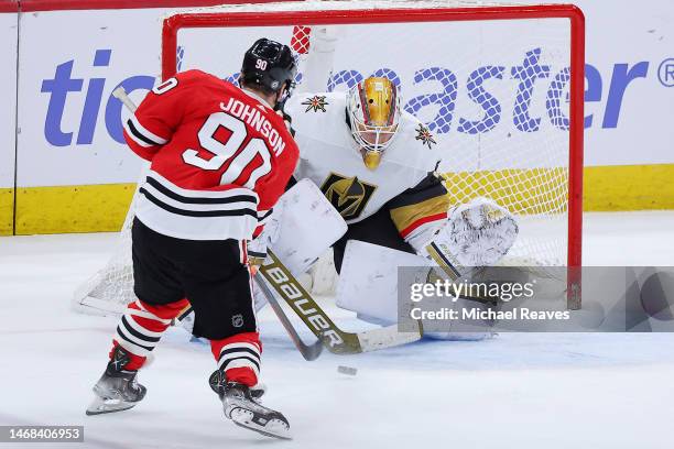 Tyler Johnson of the Chicago Blackhawks scores the game-winning shootout goal against Laurent Brossoit of the Vegas Golden Knights at United Center...