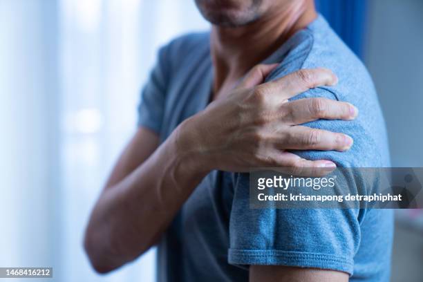 shoulder pain - muscle cramps stock pictures, royalty-free photos & images