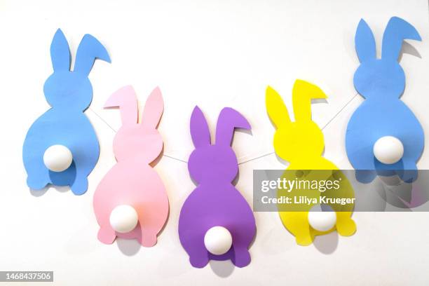 easter background with paper rabbits. - paper decoration stock-fotos und bilder