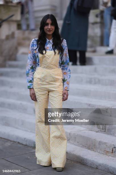 Taj Atwal seen wearing a yellow and white patterned jumpsuit and a blue flower printed blouse before the PAUL and JOE show during London Fashion Week...