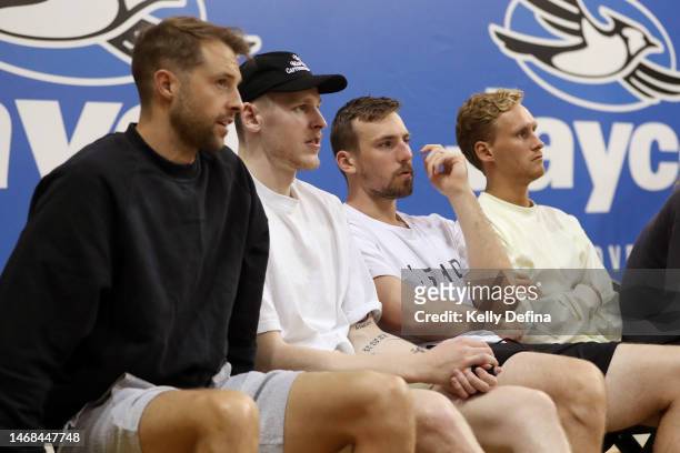 Nathan Sobey, Mitch McCarron and Kyle Adnam watch the game during the round 15 WNBL match between Southside Flyers and Melbourne Boomers at State...