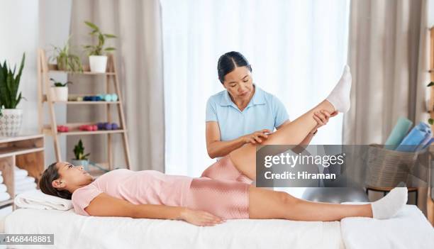 physiotherapy, knee pain or physiotherapist stretching a girl in consultation with patient for body health. asian, leg injury or chiropractor helping with a woman or person with injured muscle at spa - clinic room stock pictures, royalty-free photos & images