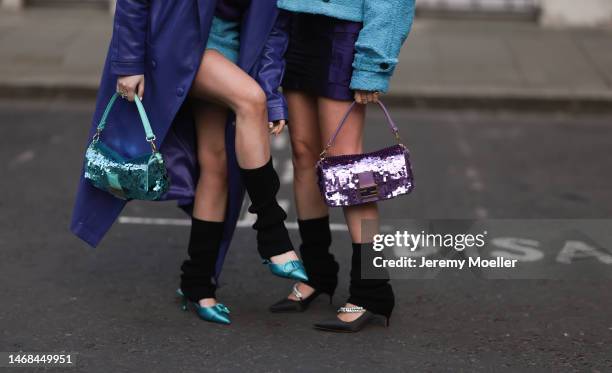 Olivia and Alice seen wearing dark shades by Versace, a sequins baguette by Fendi, a purple long leather coat, a purple sweater and a baby blue...