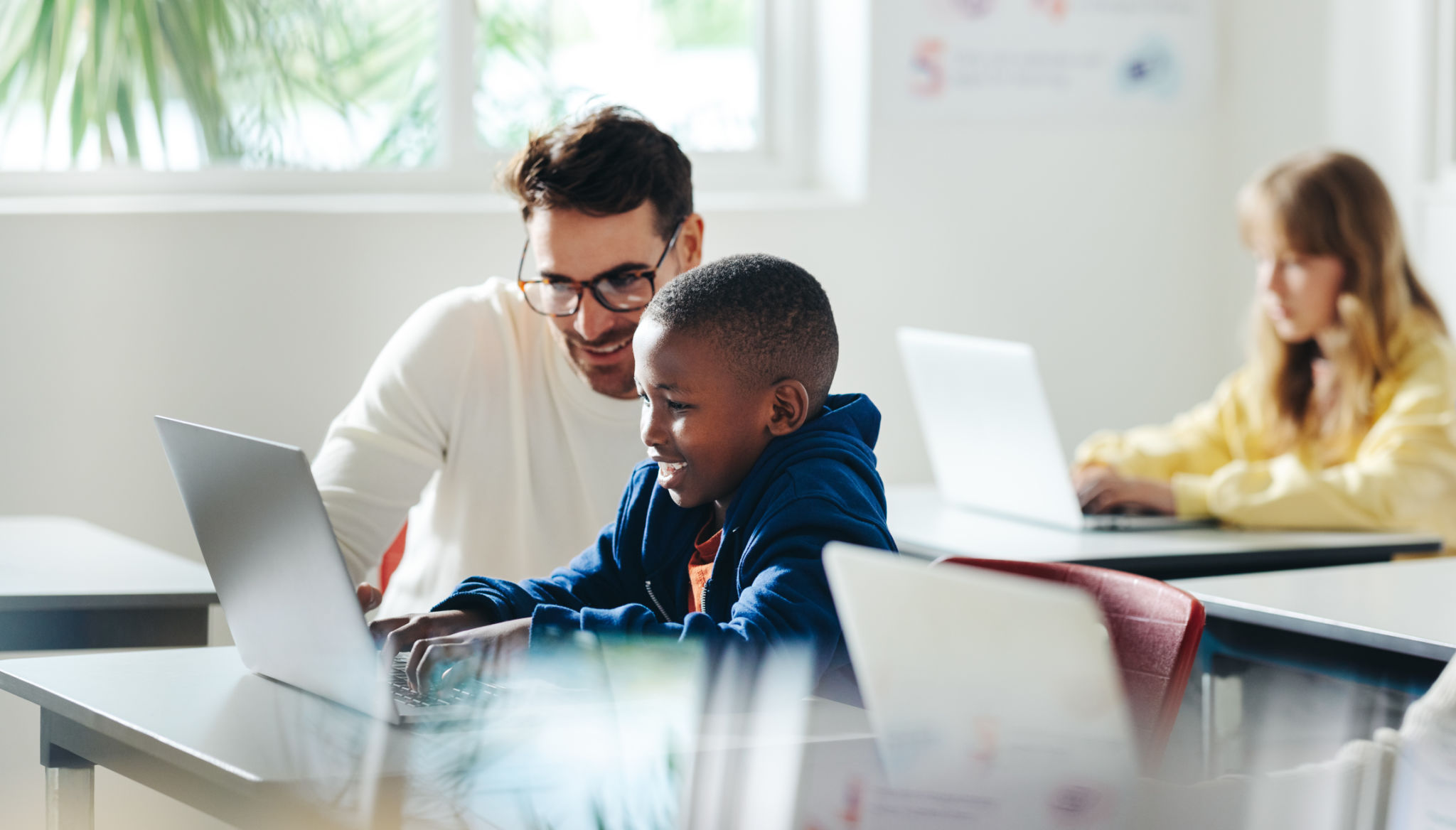 teacher helping student