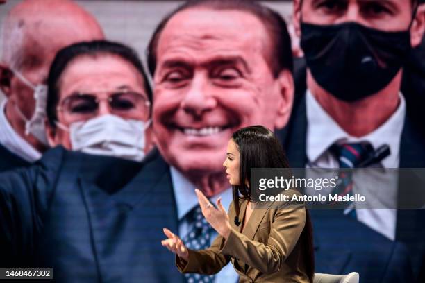 Picture of Silvio Berlusconi is displayed on the screen as Karima El Mahroug alias Ruby attends "Porta A Porta" Rai Tv Show at Rai Studios, on...