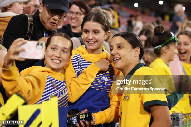 Sam Kerr of the Matildas poses with fans after winning the Cup of Nations match between the Australia Matildas and Jamaica at McDonald Jones Stadium...