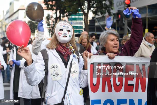 Two women with placards during a rally of striking primary care doctors and pediatricians, from the headquarters of the Directorate General of Human...