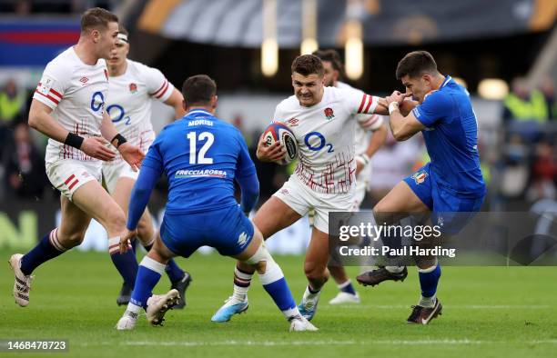 Henry Slade of England is tackled by Tommaso Allan of Italy during the Six Nations Rugby match between England and Italy at Twickenham Stadium on...