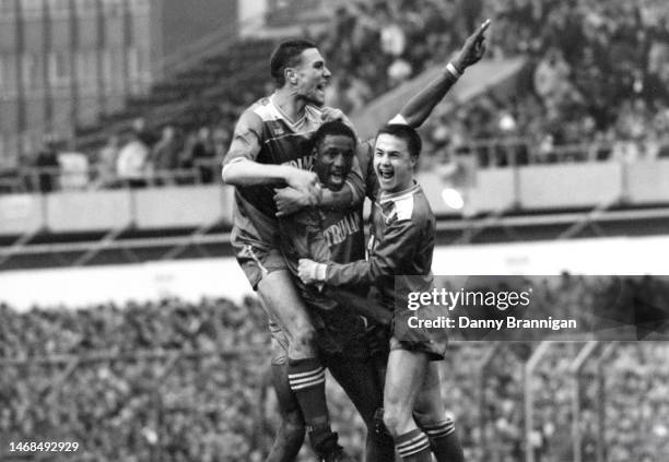 Wimbledon Goalscorer John Fashanu celebrates his goal with team mates Vinnie Jones and Dennis Wise during the FA Cup 5th Round match between...