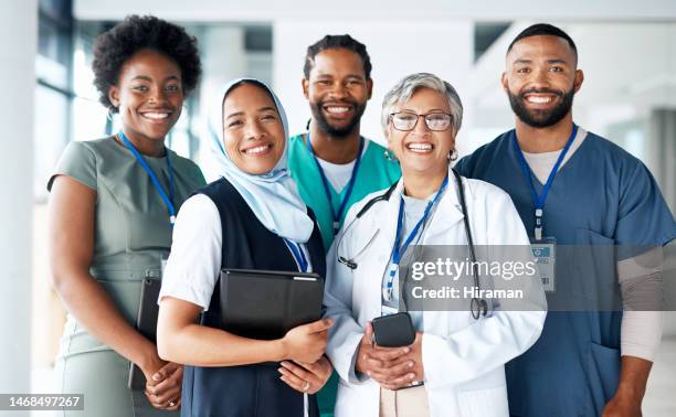 portrait, diversity and happy team of doctors with teamwork excited, positive and proud in a hospital or clinic. group, healthcare professional and medicine or medical experts in unity together - medicinskt yrke bildbanksfoton och bilder