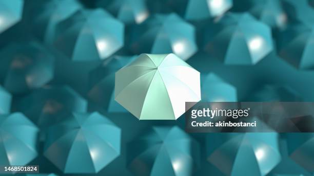umbrella, standing out from the crowd, leadership - warranty stockfoto's en -beelden