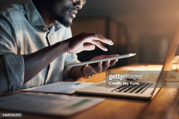 black man, hands and tablet in night office for financial management, insurance budget or interactive data analytics. zoom, businessman and working late on technology for finance growth or investment - zoom in office stock pictures, royalty-free photos & images