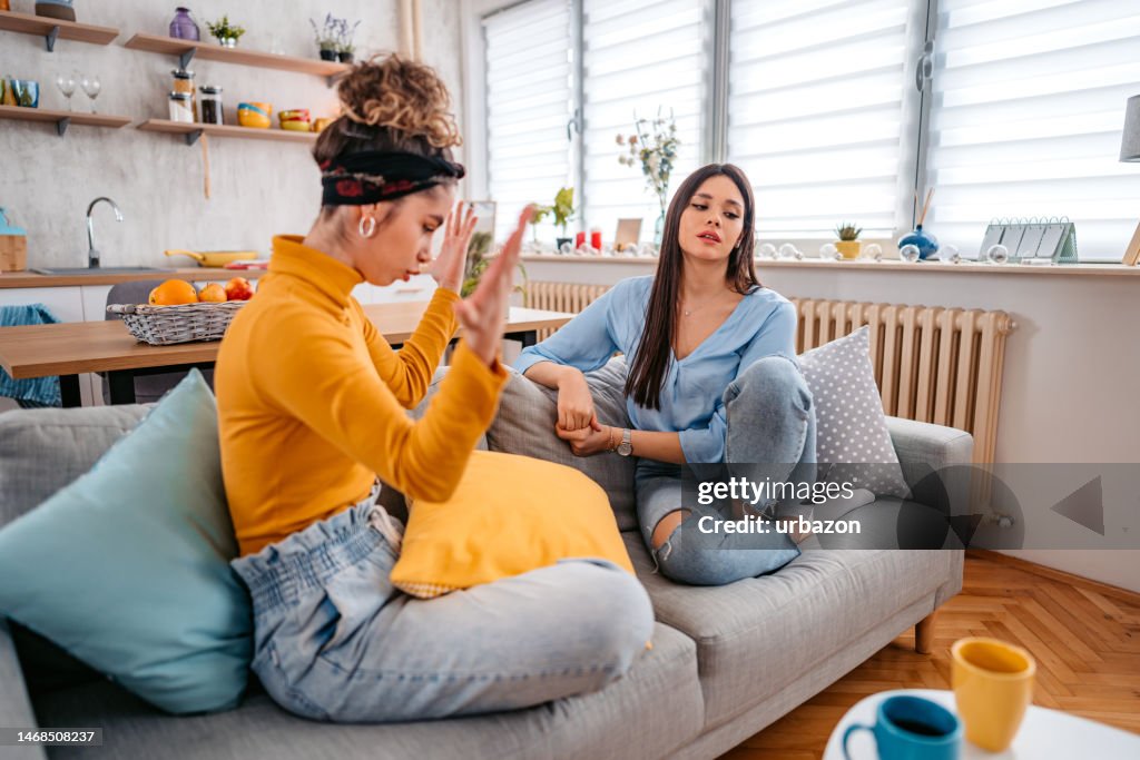 Two Young Women Arguing At Home