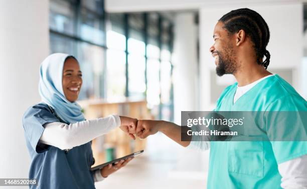 teamwork, fist bump and tablet with nurses in hospital for medical, healthcare and support. community, happy and friends with hands of people in clinic for medicine, collaboration and wellness - fist bump stock pictures, royalty-free photos & images
