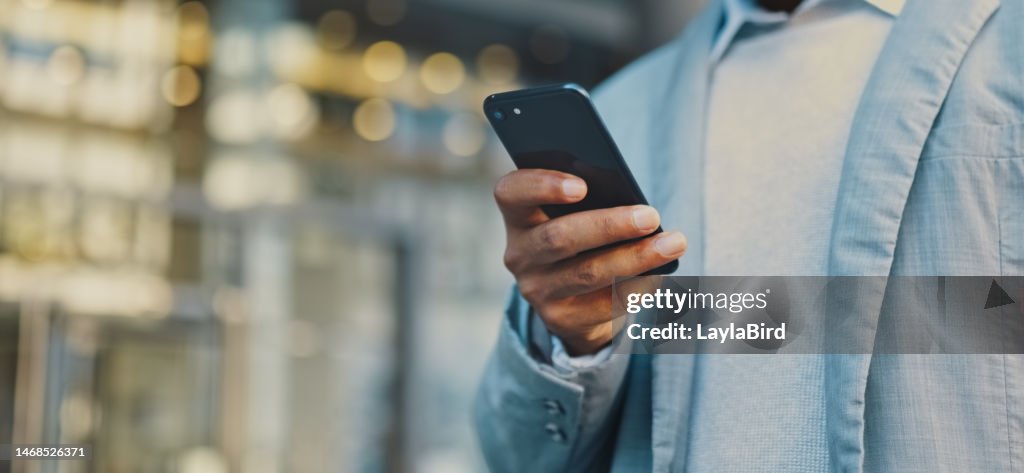 Travel business man hand with phone in city typing and walking, networking or on 5g mobile app in New York. Street, employee or worker on smartphone for communication, reading or commute to office