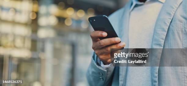 travel business man hand with phone in city typing and walking, networking or on 5g mobile app in new york. street, employee or worker on smartphone for communication, reading or commute to office - cellphone hand bildbanksfoton och bilder