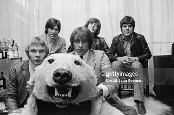 Pop group the Bee Gees posed with a stuffed polar bear in an office in London circa April 1968. Members of the band are, from left, Colin Petersen,...