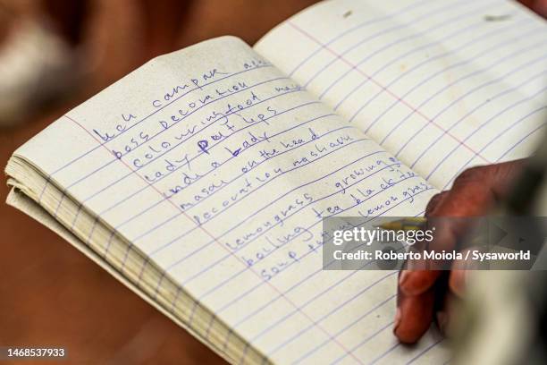 student writing on an exercise book, africa - handwriting school stock pictures, royalty-free photos & images