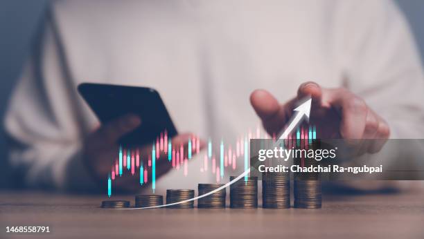 planning and strategy stock market  business growth  progress or success concept. businessman or trader showing growing virtual holographic stocks, investing in trading. - cost management stockfoto's en -beelden