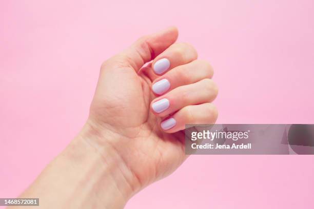 pastel nails, pastel nail polish, lavender nail color on pink background - nails imagens e fotografias de stock
