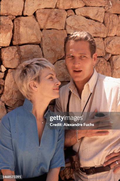 Actress Joanne Woodward and actor Paul Newman talking while visiting Masada in Israel in 1959.
