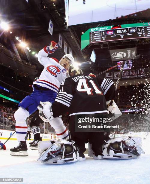 Vitek Vanecek of the New Jersey Devils defends against Nick Suzuki of the Montreal Canadiens at the Prudential Center on February 21, 2023 in Newark,...