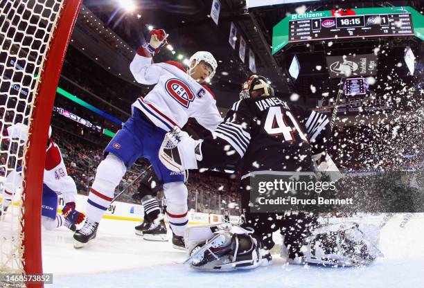 Vitek Vanecek of the New Jersey Devils defends against Nick Suzuki of the Montreal Canadiens at the Prudential Center on February 21, 2023 in Newark,...