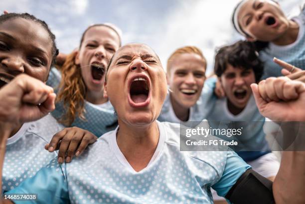 female soccer team celebrating - girl power stock pictures, royalty-free photos & images