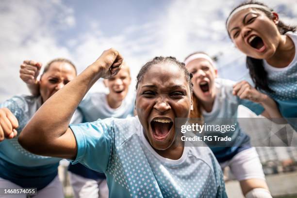 portrait of a female soccer team celebrating - womens football team stock pictures, royalty-free photos & images