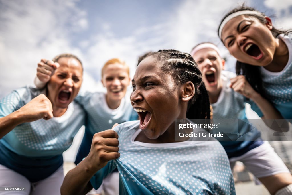 Portrait of a female soccer team celebrating