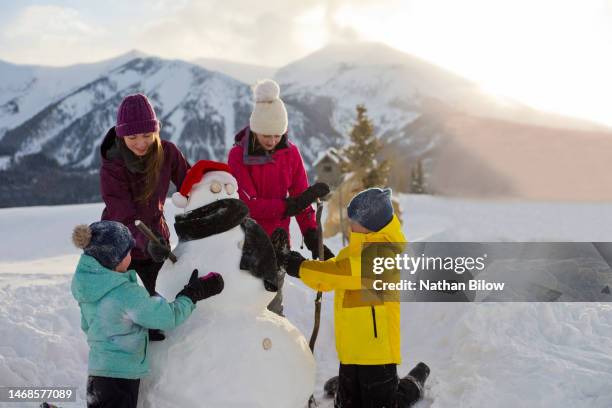 family winter fun - makers co stock pictures, royalty-free photos & images