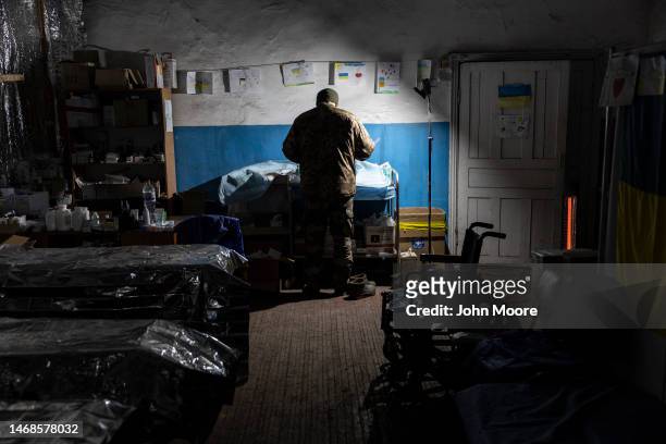 Doctor sorts medical supplies inside the Ukrainian Army's 72nd Mechanized Brigade stabilization hospital near the frontline on February 22, 2023 in...