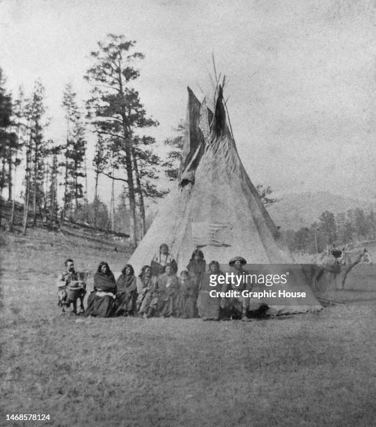 United States Army soldiers with Sioux prisoners captured during General George Crook's Horsemeat March, a military expedition pursuing a band of...