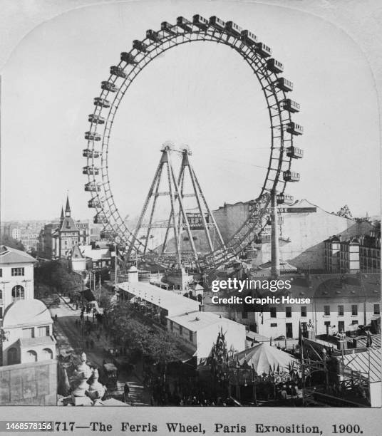 Stereoscopic image showing the Grande Roue de Paris ferris wheel in the grounds of the Exposition Universelle of 1900 in Paris, France, 1900. The...