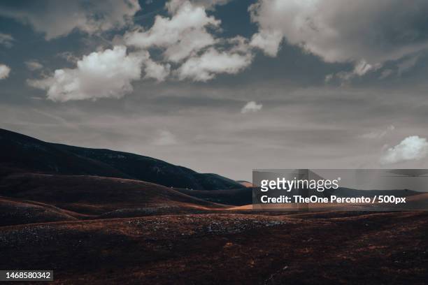 Barren Mountain Landscape With Peaks Hidden In Clouds High-Res Stock Photo  - Getty Images