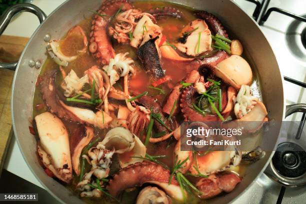 cooking cacciucco seafood soup - octopus food stock pictures, royalty-free photos & images