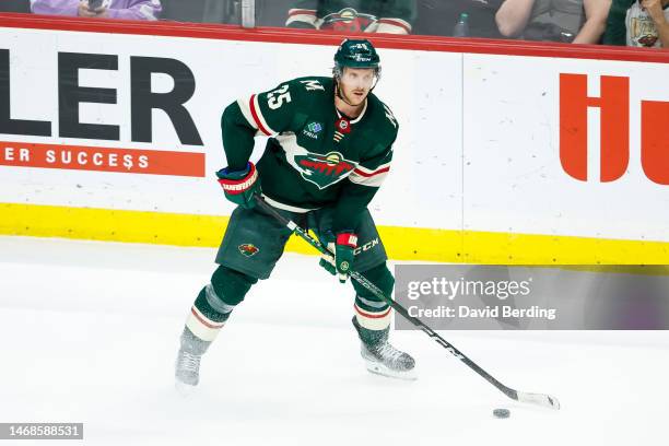Jonas Brodin of the Minnesota Wild skates with the puck against the Dallas Stars in overtime during the game at Xcel Energy Center on February 17,...