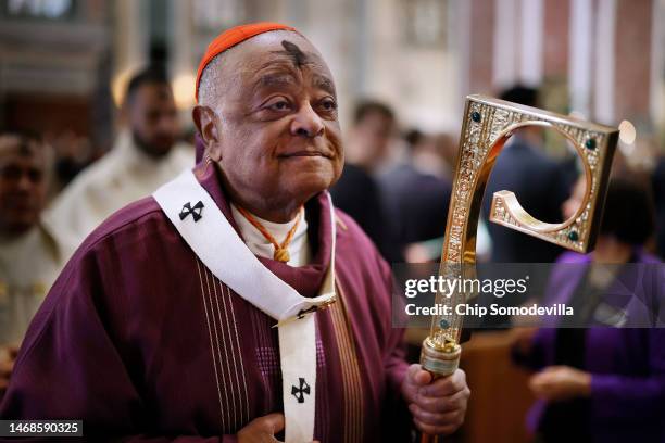 With a cross of ash on his forehead, Cardinal Wilton Gregory, archbishop of Washington, leads the recession of the Mass on Ash Wednesday at the...