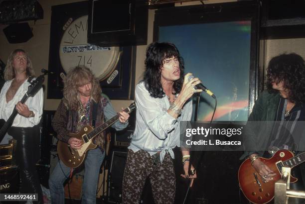 American rock band Aerosmith perform during a party they hosted for Les Paul celebrating his 75th birthday on June 12, 1990 at The Hard Rock Cafe in...