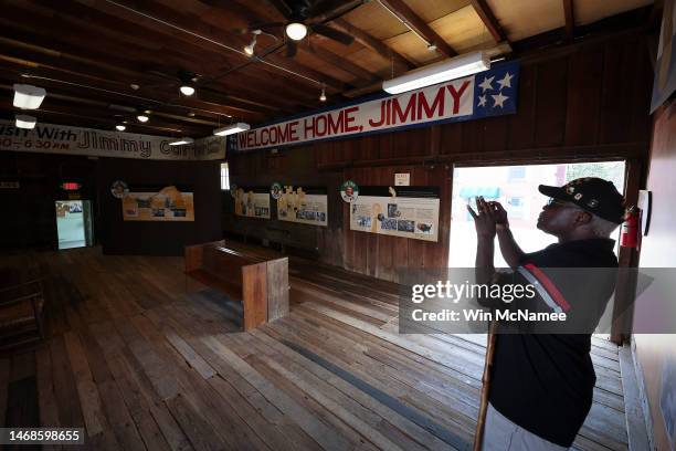 Robert Teachey photographs the interior of the Plains Depot, site of former U.S. President Jimmy Carter's 1976 campaign headquarters, in Carter's...