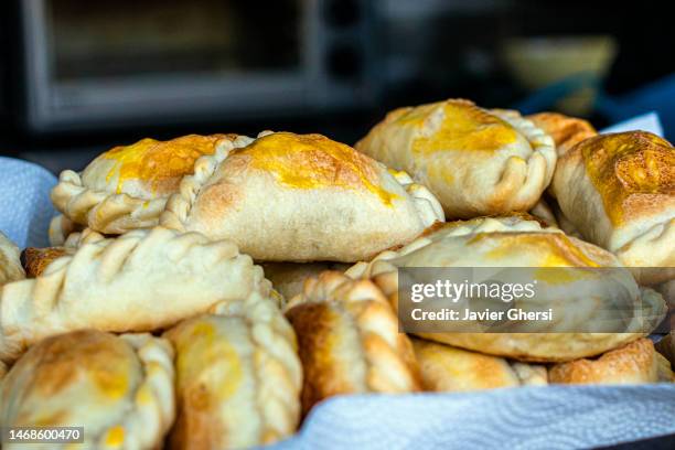 stuffed empanadas. traditional argentine food. - fried dough stock pictures, royalty-free photos & images