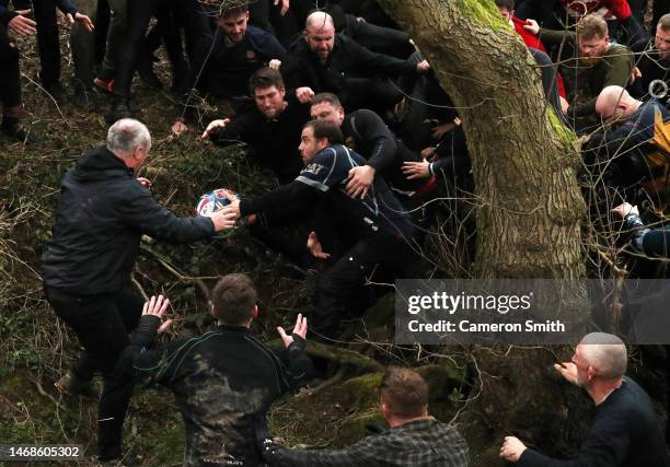 Rival teams the 'Up'ards and Down'ards' take part in the Royal Shrovetide Football match on February 22, 2023 in Ashbourne, England. Played since the...