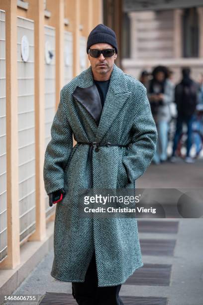 Alex Badia is seen wearing herringbone pattern coat outside Iceberg during the Milan Fashion Week Womenswear Fall/Winter 2023/2024 on February 22,...