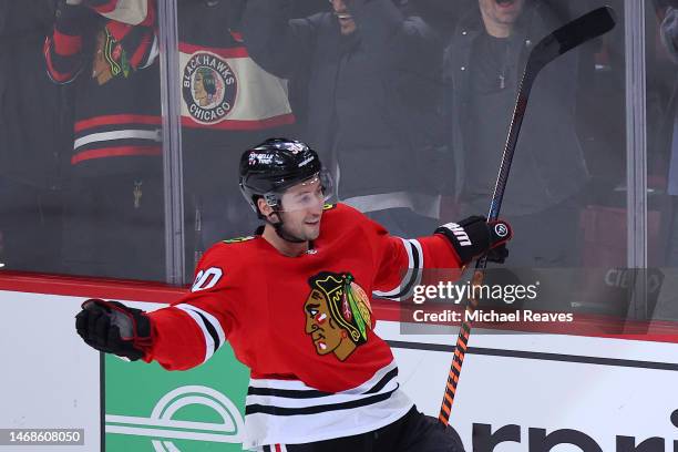 Tyler Johnson of the Chicago Blackhawks celebrates after scoring the game-winning shootout goal against Laurent Brossoit of the Vegas Golden Knights...