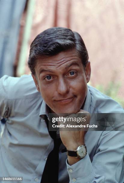 Actor Dick Van Dyke portrait in a blue shirt and goofing at Los Angeles, California in 1964.